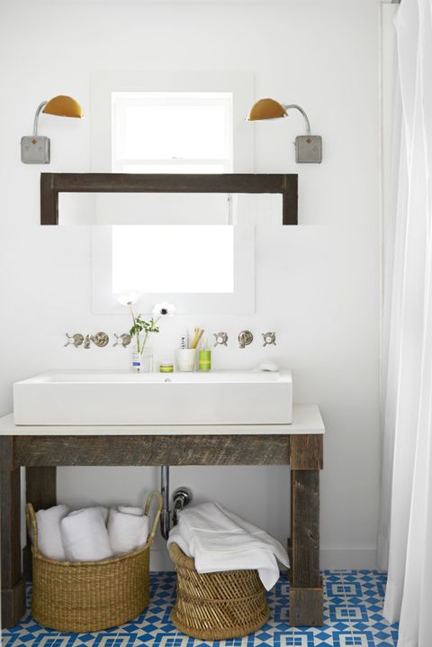 bathroom with baskets under sink