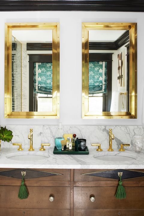 gold mirrors and bathroom vanity