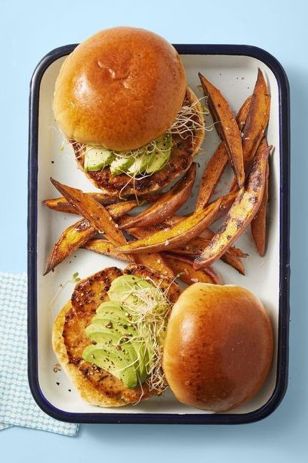 salmon burgers topped with sliced avocado and sweet potato fries recipe